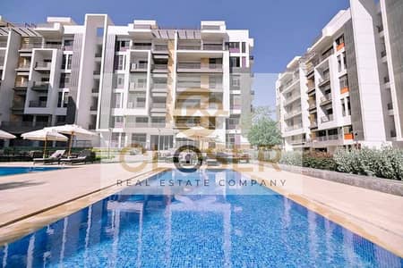 Apartment Overlooking the Lagoon in a Prime Location Next to AUC with a Down Payment of ( 500k Only ) & the Nearest Delivery Date in 5th Settlement