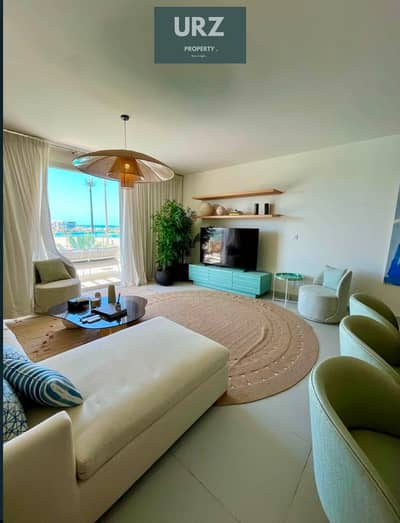 في شالية صف اول lagoon & seaview بموقع بانورامي fully finished + ACs مميز وبخصم 35 % من سعر للبيع في الساحل الشمالي بالقرب مراسي و مدن و ذا مد و سيزن
