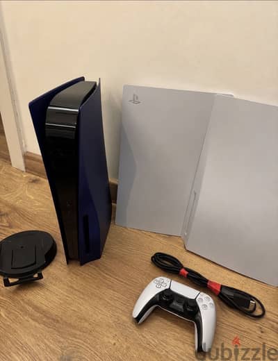 PlayStation 5 with purple covers and 1 controller.