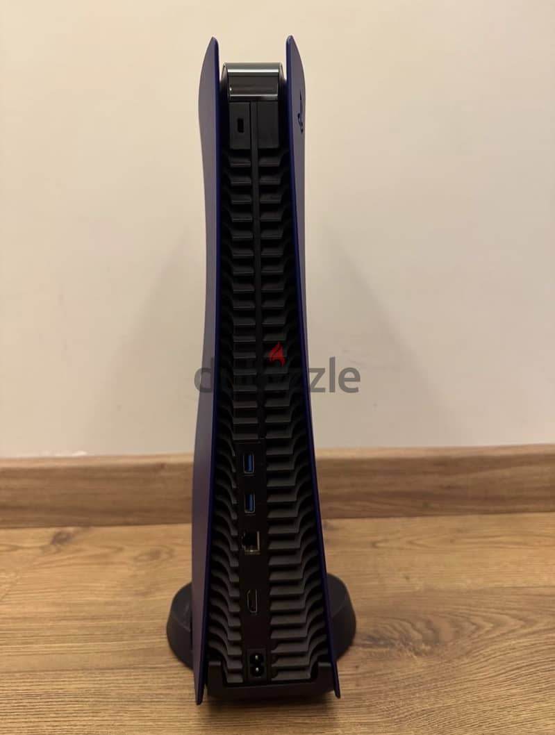 PlayStation 5 with purple covers and 1 controller. 1