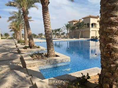 VIP chalet for sale in La Vista Gardens, Ain Sokhna, with a stunning sea view and a prime location just 11 km from Porto Sokhna. It features an excell