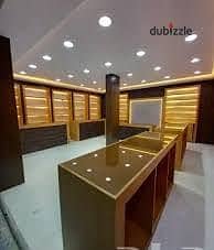 Commercial shop of 30 m for rent suitable for any commercial activity super lux finishing all facilities available water and electricity in Alexandria Al-Ajmi kilo 21 October main street before the distinguished gate
