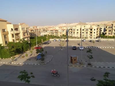 Apartment for rent in Al-Khamayel Compound (Phase 3), Sheikh Zayed. Features a modern finish and an installed kitchen; boasts a prime location and view