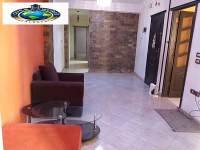 Apartment semi-furnished for rent in New Maadi, 77 Street near Swaris Square and the metro station, it has an aluminum kitchen, an extractor, a microwave, a heater, and a lounge with two armchairs and a table. The apartment is on the 10th floor with an elevator and has a terrace.