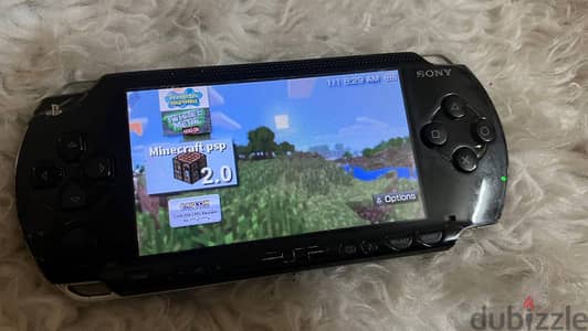 psp 1000+ +شاحن + الكرت4جيجا +بطارية
