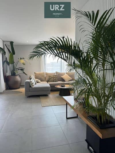 2 Bedroom apartment with a stunning double view 12-year installments or huge discount, on Suez Road minutes from AUC near Madinaty The Spine Tower