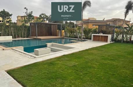 5-bedroom villa directly on the lagoon for sale in the best location in New Cairo opposite spine Madinaty near SODIC and Swan Lake Stone Park