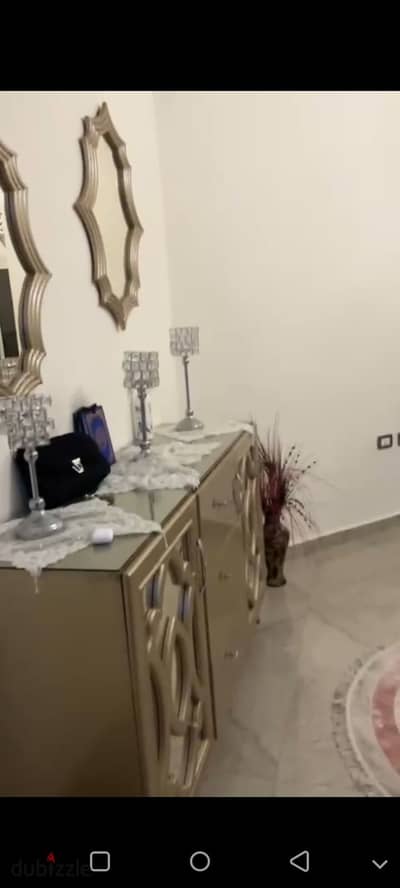 Furnished apartment for rent in Southern Lotus, third floor with elevator, front view, new furniture and appliances, air conditioning, and garage. 3 bedrooms, including a master, and 2 bathrooms in New Cairo.