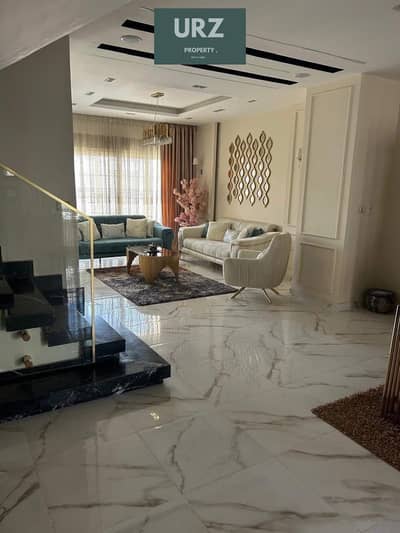 For sale 12 year villa 5 bedrooms with a distinctive garden view in Butterfly on the Suez Road near Mountain View and SODIC.