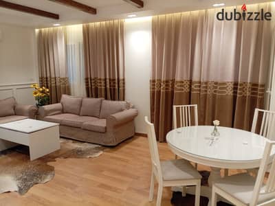 For lovers of ground floor with a garden, a furnished studio for rent in Madinaty, ultra super deluxe finishes, modern furniture, close to services