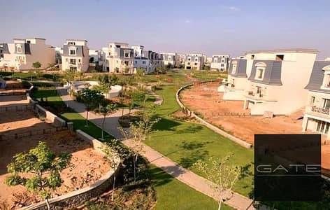 Villa for sale, ready for immediate handover, in Mountain View Chillout Park (Type B). Prime location with a view of the compound's landscaping.