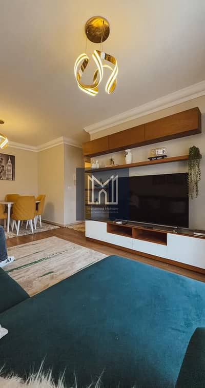 For rent in B10 Madinaty, a fully furnished two-bedroom apartment with appliances, air conditioning, and Wi-Fi