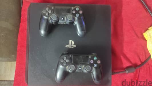 playstation 4 pro with two controllers