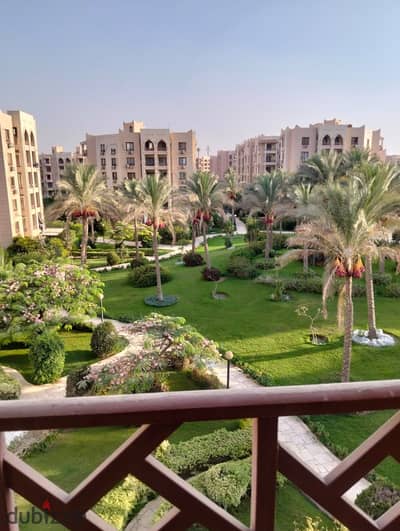 For rent, an apartment measuring 90 m in Al Rehab with a wooden kitchen
