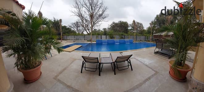 Luxury villa with swimming pool, hotel finishes on a large land area of 1010 square meters for sale in Madinaty