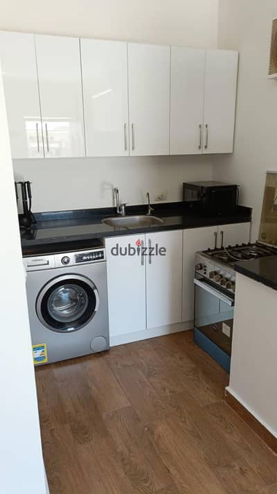 Studio with a bathroom, office, and large furnished terrace, air-conditioned, Sheikh Zayed