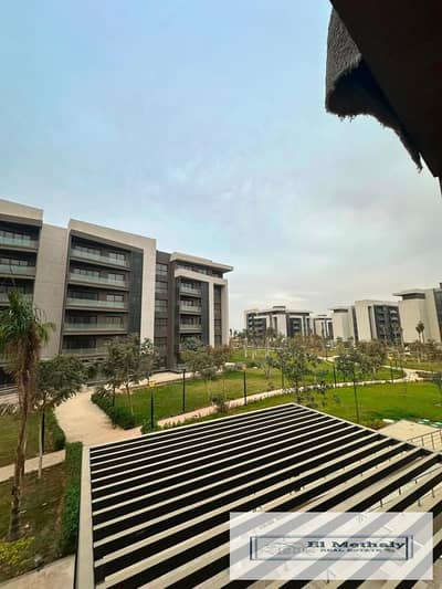 Apartment for sale in Madinaty, New Cairo (to take over remaining installments); features a wide garden view.
