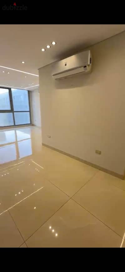 New apartment for rent in One Katameya Compound, super deluxe finishing, with air conditioning, kitchen, and parking space.