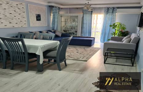 Fully furnished hotel-style apartment for rent in Al Rehab 2 New Cairo 131 sqm 1st floor north facing 3 bedrooms 2 bathrooms wide garden view near Eas