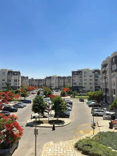 140 sqm apartment for sale in Madinaty (B10); custom "Ultra Super Lux" finishing; view overlooking an open parking area.