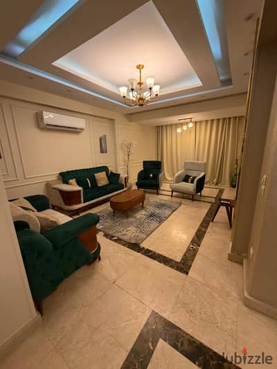 A fully furnished 200 sqm ground-floor apartment with a private garden for rent in Leila Compound, First Settlement, directly on Mohamed Naguib Axis a