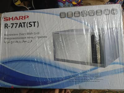 ميكرويف بفرن وشوايه شارب جديد متبرشم متفتحش من الكرتونه