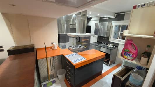 Apartment for sale with kitchen and air conditioning, super lux finishing - in Zahraa El Maadi, a prime location next to Street 50 and Hub 50 Mall