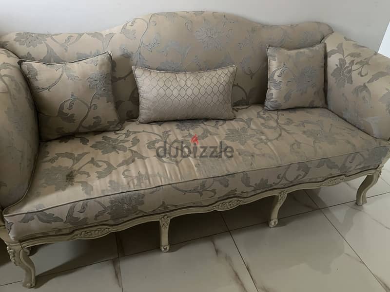 A sofa and two armchairs 1