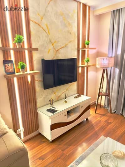 Furnished apartment available for rent in Madinaty: 2 bedrooms, 1 bathroom, high-end finishes, modern furnishings, close to amenities.