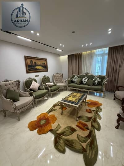 For rent, a furnished hotel apartment in Compound One Katameya, a prestigious and distinctive location with a garden view, a fully serviced compound adjacent to main roads.