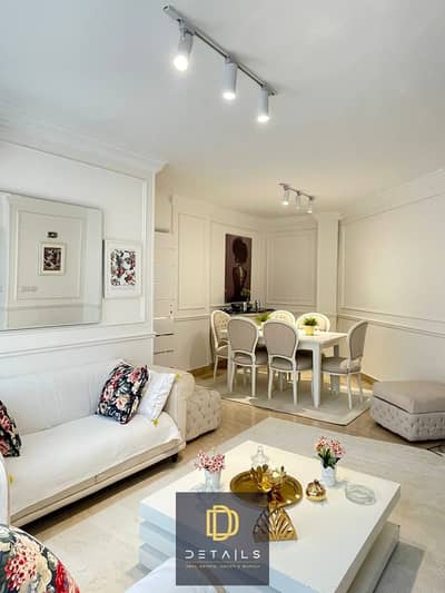 Ground-floor apartment with a garden for rent in Opera City, Sheikh Zayed, fully furnished with complete hotel-style furniture.