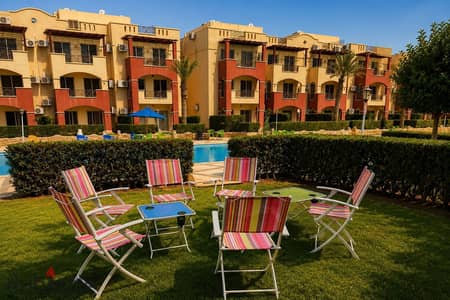 Chalet with two rooms on the ground floor with a garden by the pool, Lasarina Village