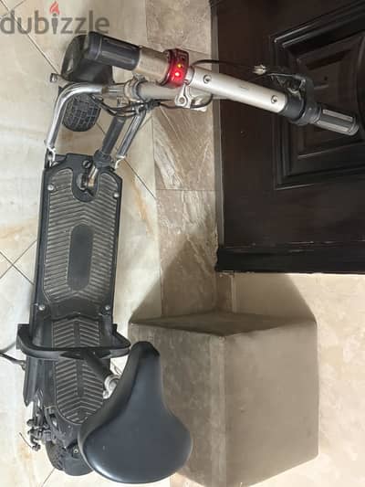 ‏سكوتر كهرباء كرسي
