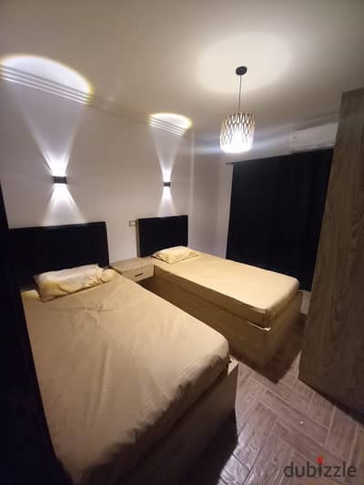 Furnished apartment for rent, two bedrooms and a bathroom in Ashjar Darna Compound on the Maadi Ring Road directly. There is security and guarding. If for a year, 25,000 LE monthly. If for 6 months or less, 30,000 LE. All services available, 15 minutes from Fifth Settlement and minutes from Fifty Mall. Very close to Carrefour. For details, WhatsApp 01503622666.