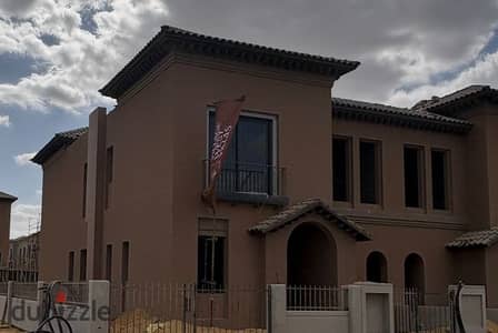 A twin house villa for sale in installments, ready for visiting, in Village West Compound, Sheikh Zayed