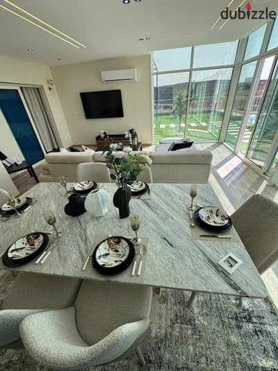 Apartment for sale with a 40% discount rented in dollars pool view for sale minutes from Sheraton Taj City and Cairo Airport