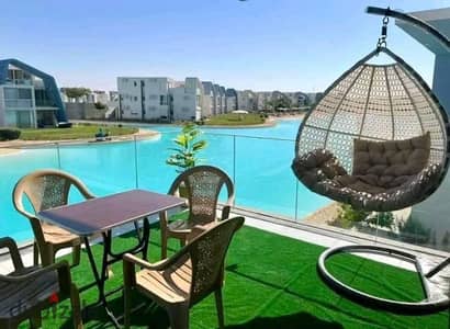 own a two-bedroom chalet with the highest rental yield first row on Crystal Lagoon minutes from Jun Sodic Salt Summer modon Ramla