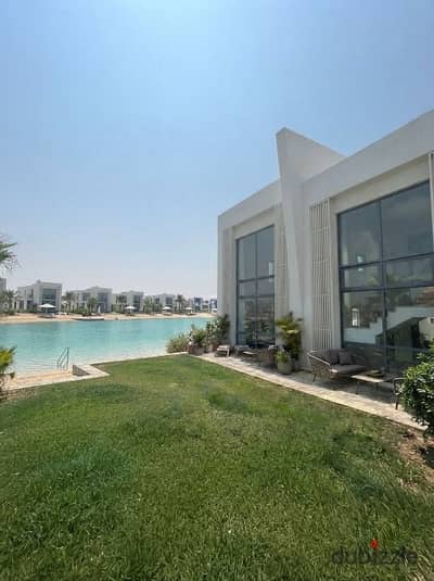 Ground-floor chalet with garden, first row lagoon view, ACs, installments, and 35% discount in Ras El Hekma near The Med, Azha & Cascades.