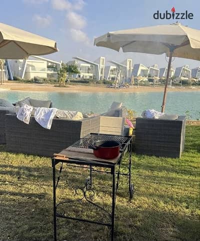 Ground-floor chalet with garden, first row lagoon view, ACs, installments, and 35% discount in Ras El Hekma near The Med, Azha & Cascades.