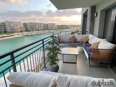 بسعر لقطة فرصة استثمارية شالية صف اول lagoon تشطيب كامل + التكيفات فيو مميز للبيع في الساحل الشمالي بالقرب من  الماظة باي و مرسي بغوش و سمر وبيت البحر