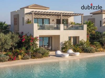 تاون هاوس بسعر شالية Double heights تقسيط علي 10 سنين صف اول تشطيب كامل للبيع في الساحل الشمالي في راس الحكمة بالقرب من سيزن و نايا وكالي كوست