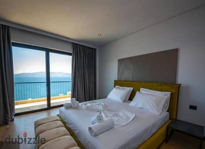 5 year installments up to 30% discount own chalet with direct sea view luxury hotel finishes with ACs in North Coast next to The Waterway Soul
