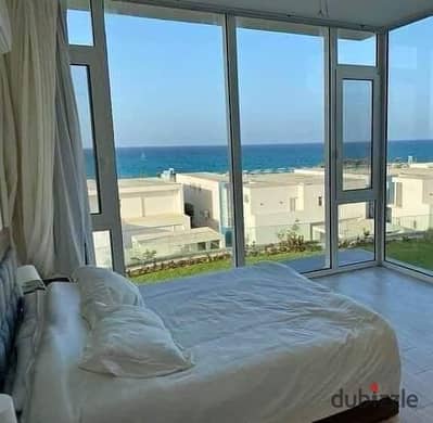 Two-bedroom chalet first row on Crystal Lagoon for sale in Ras El Hekma North Coast next to modon near Mountain View cali coast dose  La Vista