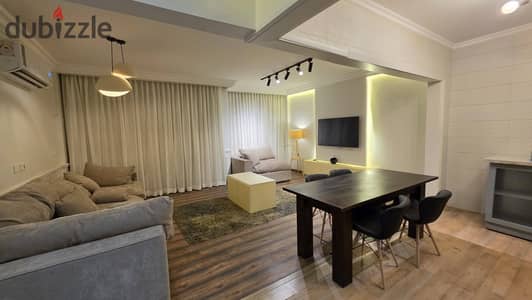 2-bedroom apartment for sale in Center Park, New Cairo. Installments up to 12 years or 50% cash discount. Prime location on Suez Road near AUC