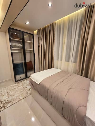 2-bedroom apartment for sale in Center Park, New Cairo. Installments up to 12 years or 50% cash discount. Prime location on Suez Road near AUC
