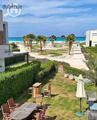 2-Bedroom ground-floor chalet with private garden first-row sea & lagoon view 9year installments fully finished with ACs Ras El Hekma near Seash