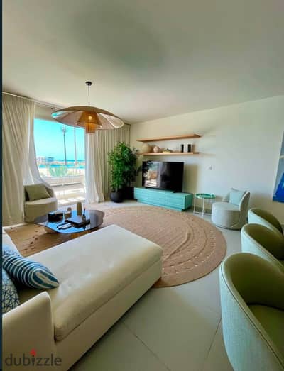في شالية صف اول lagoon & seaview بموقع بانورامي fully finished + ACs مميز وبخصم 35 % من سعر للبيع في الساحل الشمالي بالقرب مراسي و مدن و ذا مد و سيزن
