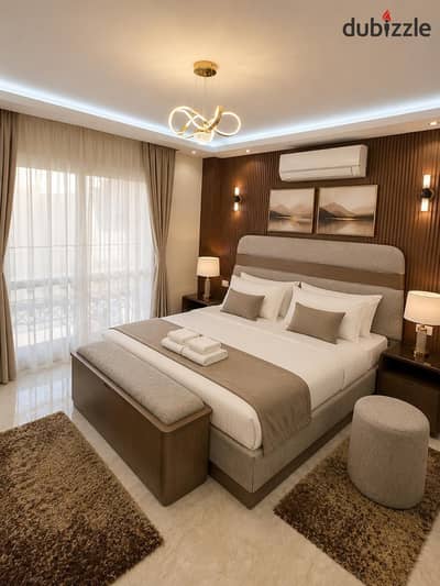For rent, an apartment furnished with luxurious hotel-style furniture, area 211 square meters, a very special catch, distinctive area
