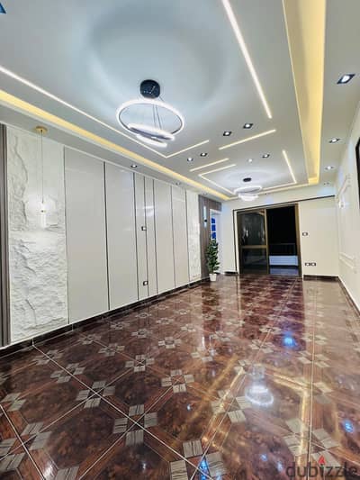 A flat in Al-Ajami, the beach of Al-Nakheel, seventh building from the sea, with a complete sea view, luxurious and distinctive finishing.