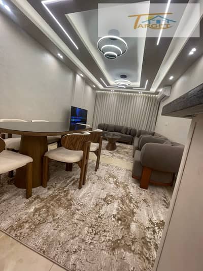 Furnished apartment for rent in Madinaty (B12): 3 bedrooms, 2 bathrooms, ultra-super-lux finish, and hotel-style furnishing.
